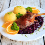 Duck with dumplings and red cabbage