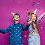 Portrait of positive cheerful little girl and boy, have fun isol