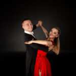 Dance ballroom young couple, girl in red dress
