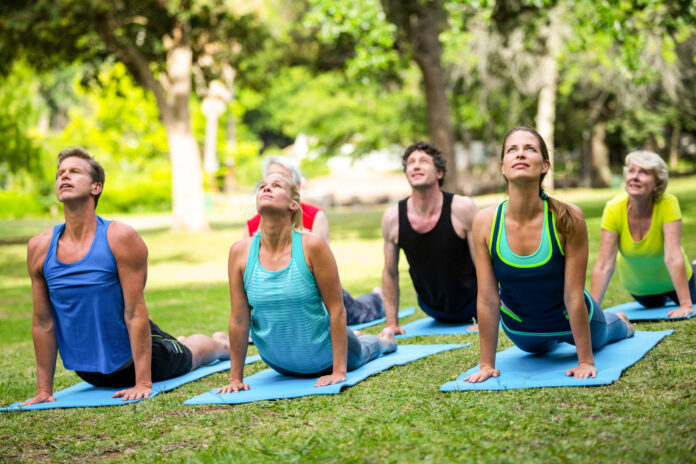 Fitness class practicing yoga