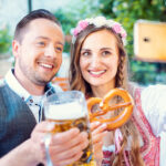 Couple in German beer garden taking a selfie picture with the phone